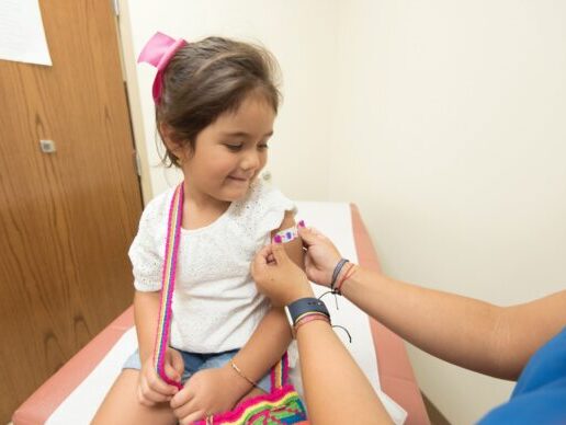 girl getting vaccine