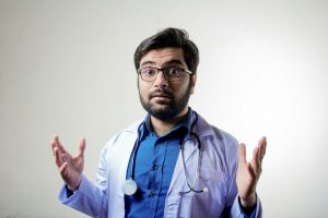 man in blue button up shirt wearing black framed eyeglasses